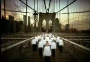 Kids singing in the Brooklyn Bridge with the World Trade Centre.
