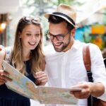 Traveling and Marketing Banner Image - Travel. Tourist couple traveling, Walking on street. Portrait of beautiful young people