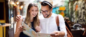Traveling and Marketing Banner Image - Travel. Tourist couple traveling, Walking on street. Portrait of beautiful young people