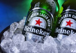 Bottles of Heineken beer in bucket with crushed ice