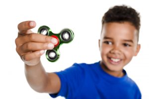 boy with fidget spinner