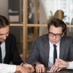 business people playing a game in their office