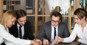 business people playing a game in their office