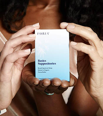 Women holding the female-targeted CBD suppositories. Not shown: They are also laughing while eating yogurt.