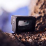 gopro camera sitting on rocks