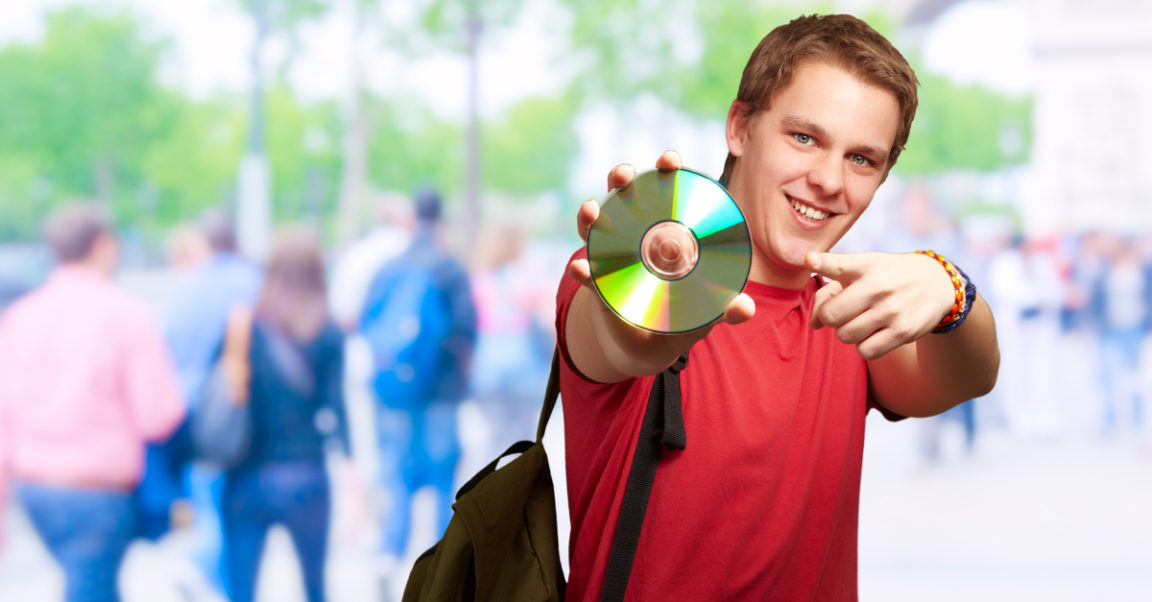 happy guy holding a cd