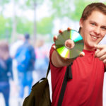 happy guy holding a cd