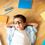 kid with stationary