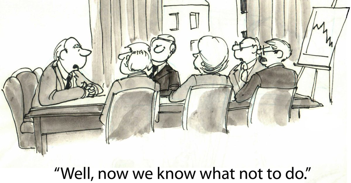 Cartoon with a board meeting and someone saying "Well, now we know what not to do"