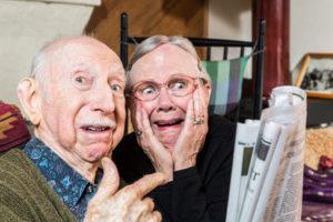 old people with newspaper