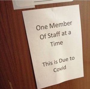 one member of staff at a time toilet sign