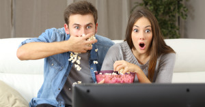 over acting couple watching tv