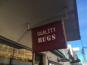 quality rugs sign