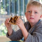 sad kid eating vegemite