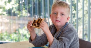 sad kid eating vegemite