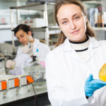 woman holding beaker