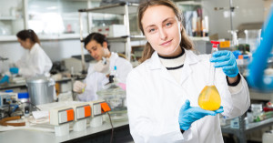 woman holding beaker