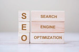SEO (Search Engine Optimisation) text wooden cube blocks on table background