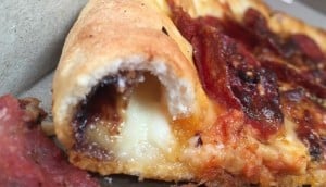 close up of vegemite filled pizza crust