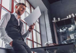 Young man with a screenplay in the office