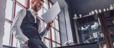 Young man with a screenplay in the office