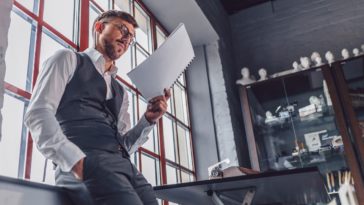 Young man with a screenplay in the office